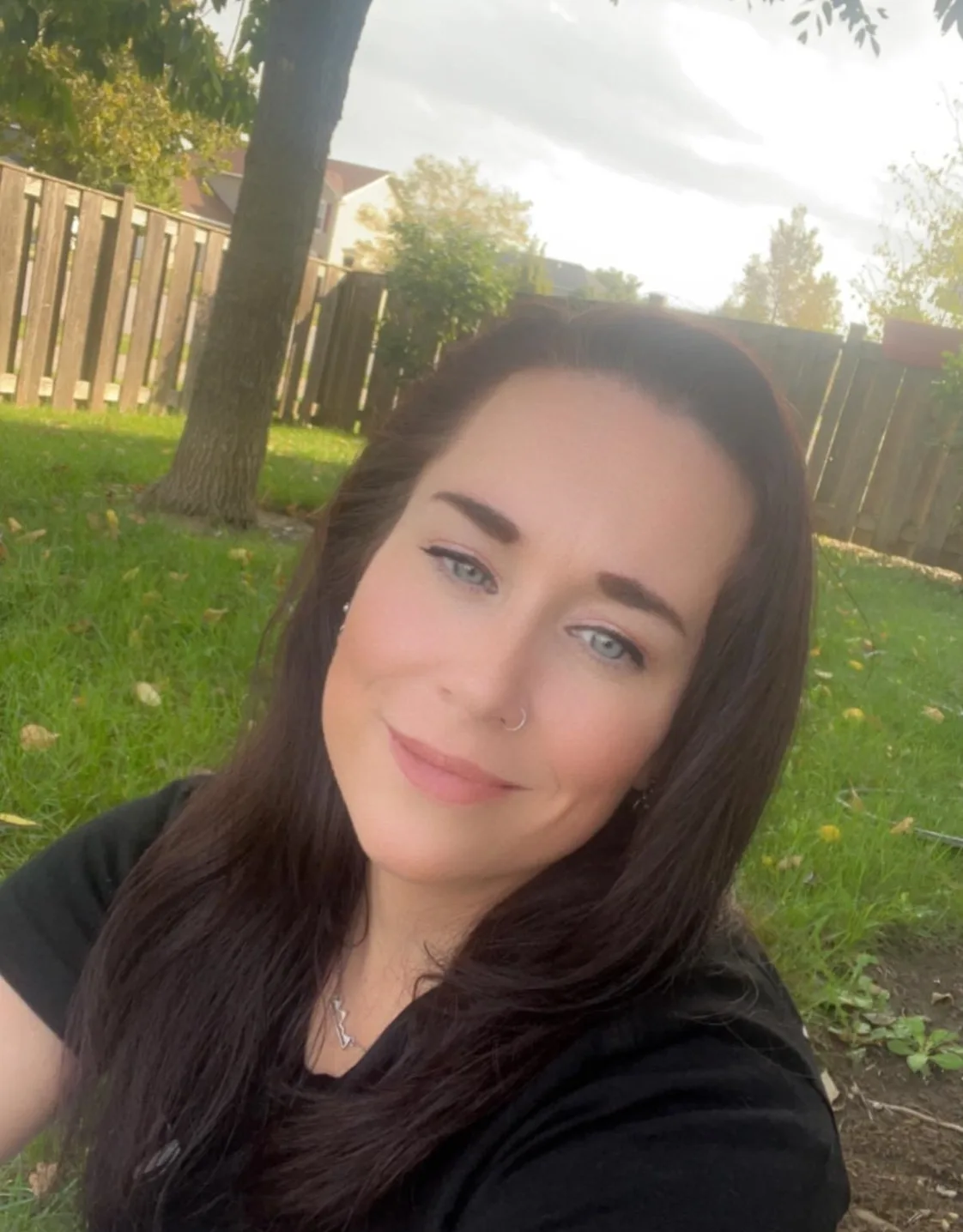 Mary in a backyard. Mary in a backyard.