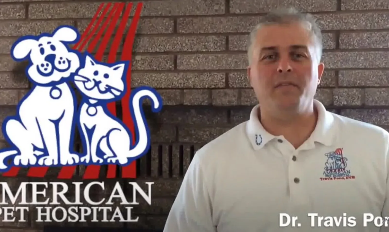 Dr. Travis Pond standing next to the American Pet Hospital logo