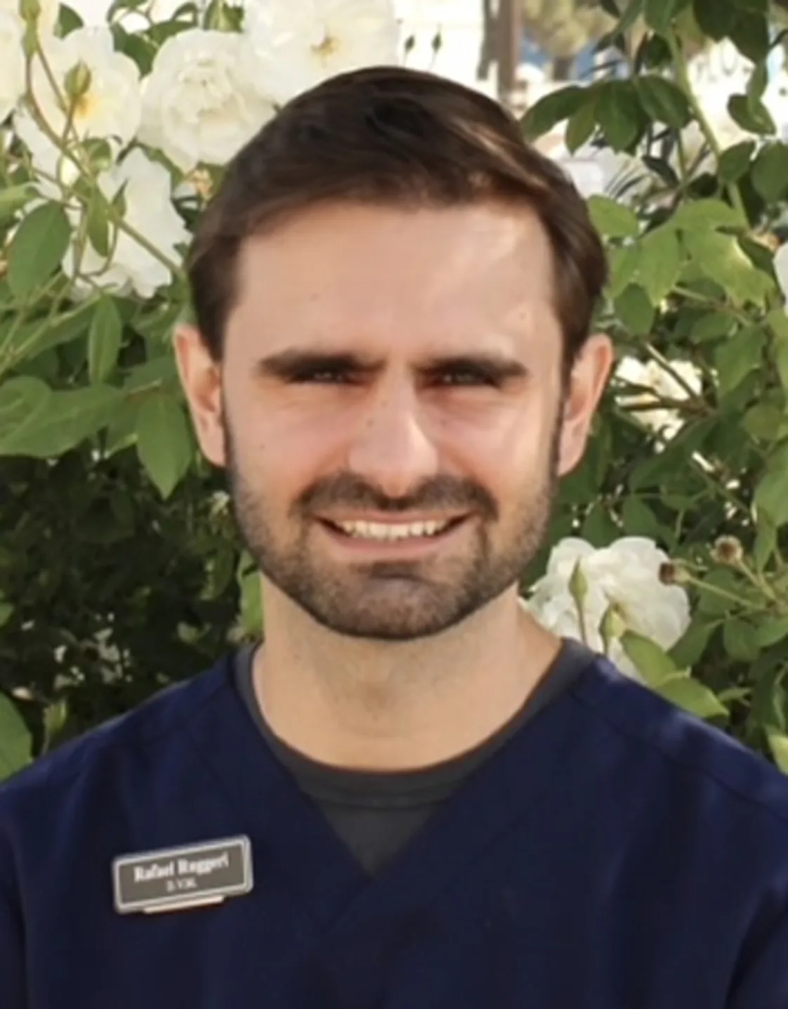 Man with dark blue shirt smiling at camera Man with dark blue shirt smiling at camera