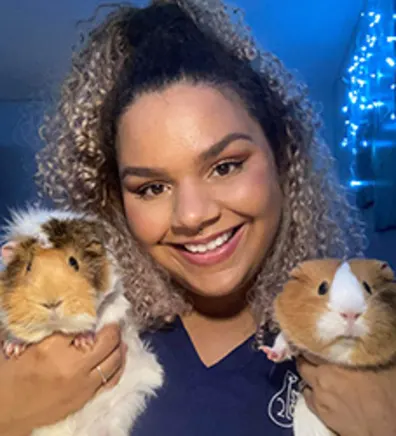 Ann with two guinea pigs Ann with two guinea pigs