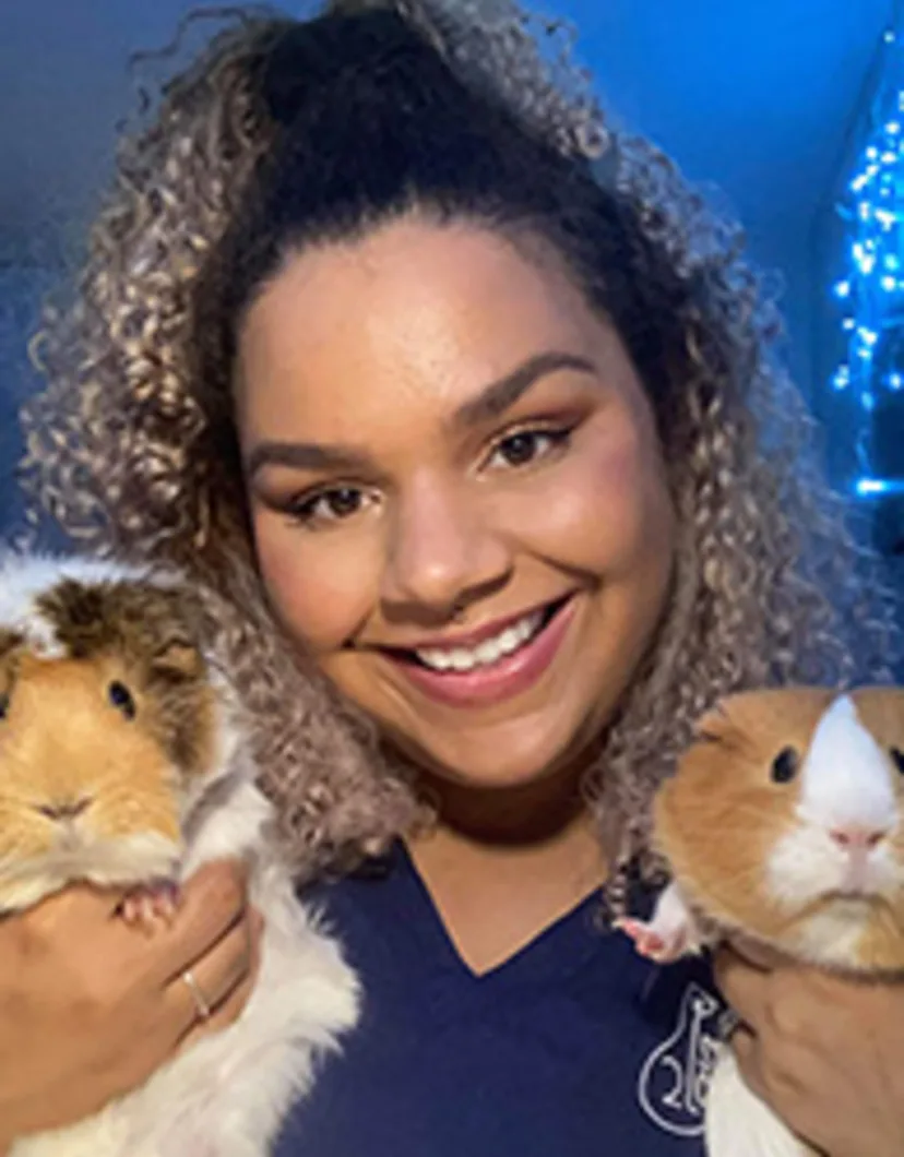 Ann with two guinea pigs