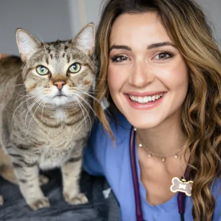 Dr. Katrina Barth smiling with a cat