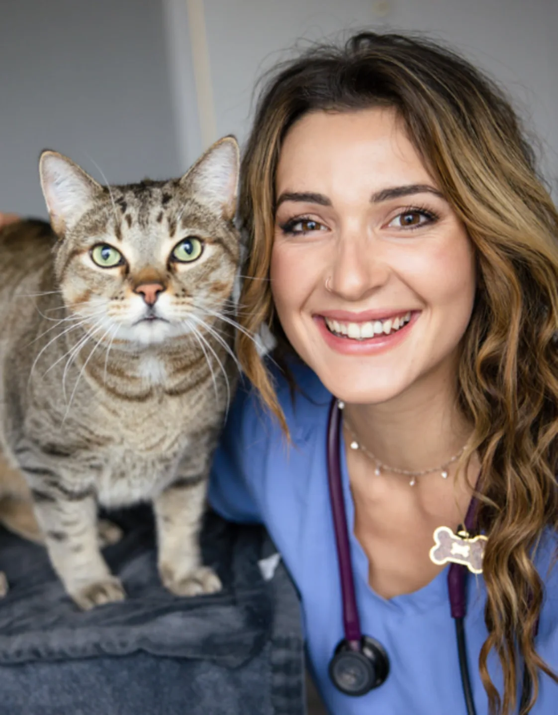 Dr. Katrina Barth smiling with a cat Dr. Katrina Barth smiling with a cat