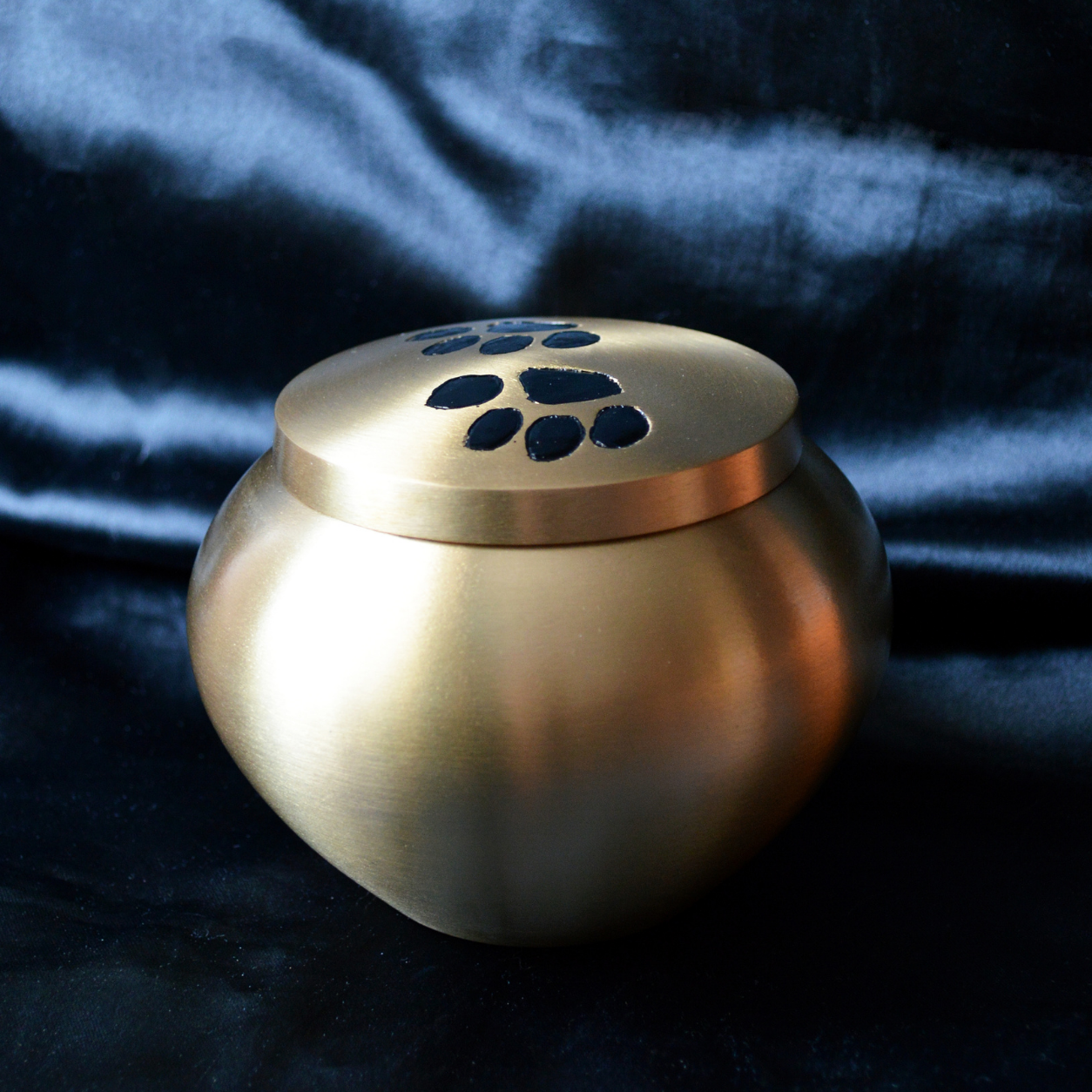Pewter pet urn with paw prints