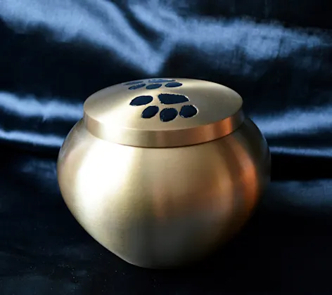 Pewter pet urn with paw prints Pewter pet urn with paw prints