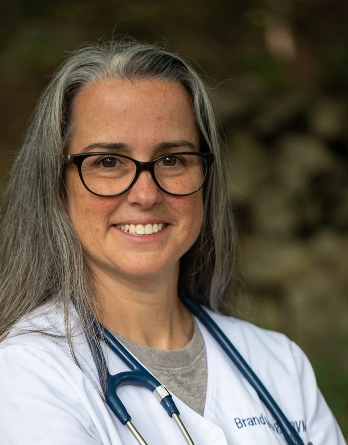 Dr. Brandy Tanguay in front of a tree Dr. Brandy Tanguay in front of a tree