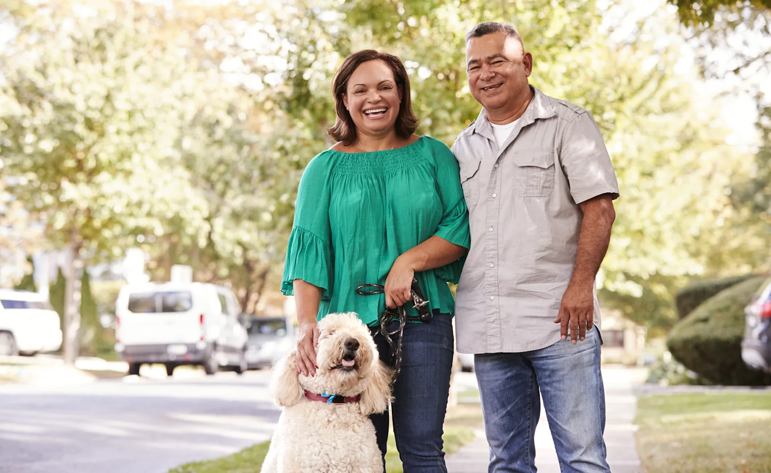 Family with dog on the sidewalk