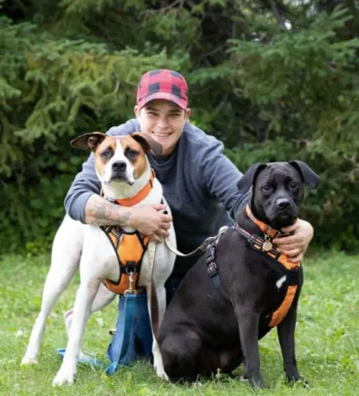 Andra posing with two dogs