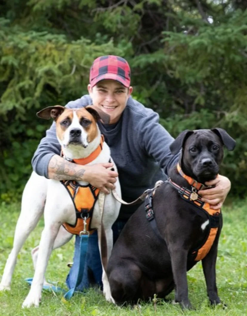 Andra posing with two dogs