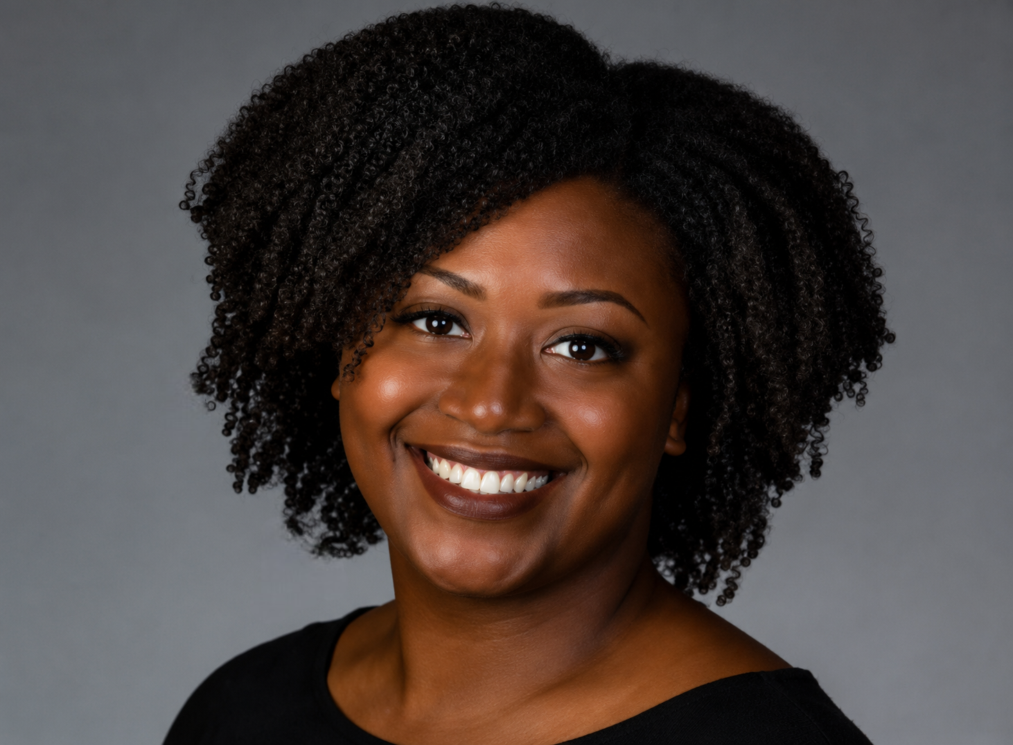 Dr. Leah Douglas in a black shirt smiling