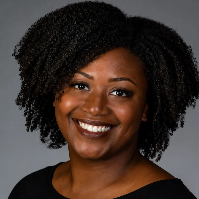 Dr. Leah Douglas in a black shirt smiling Dr. Leah Douglas in a black shirt smiling