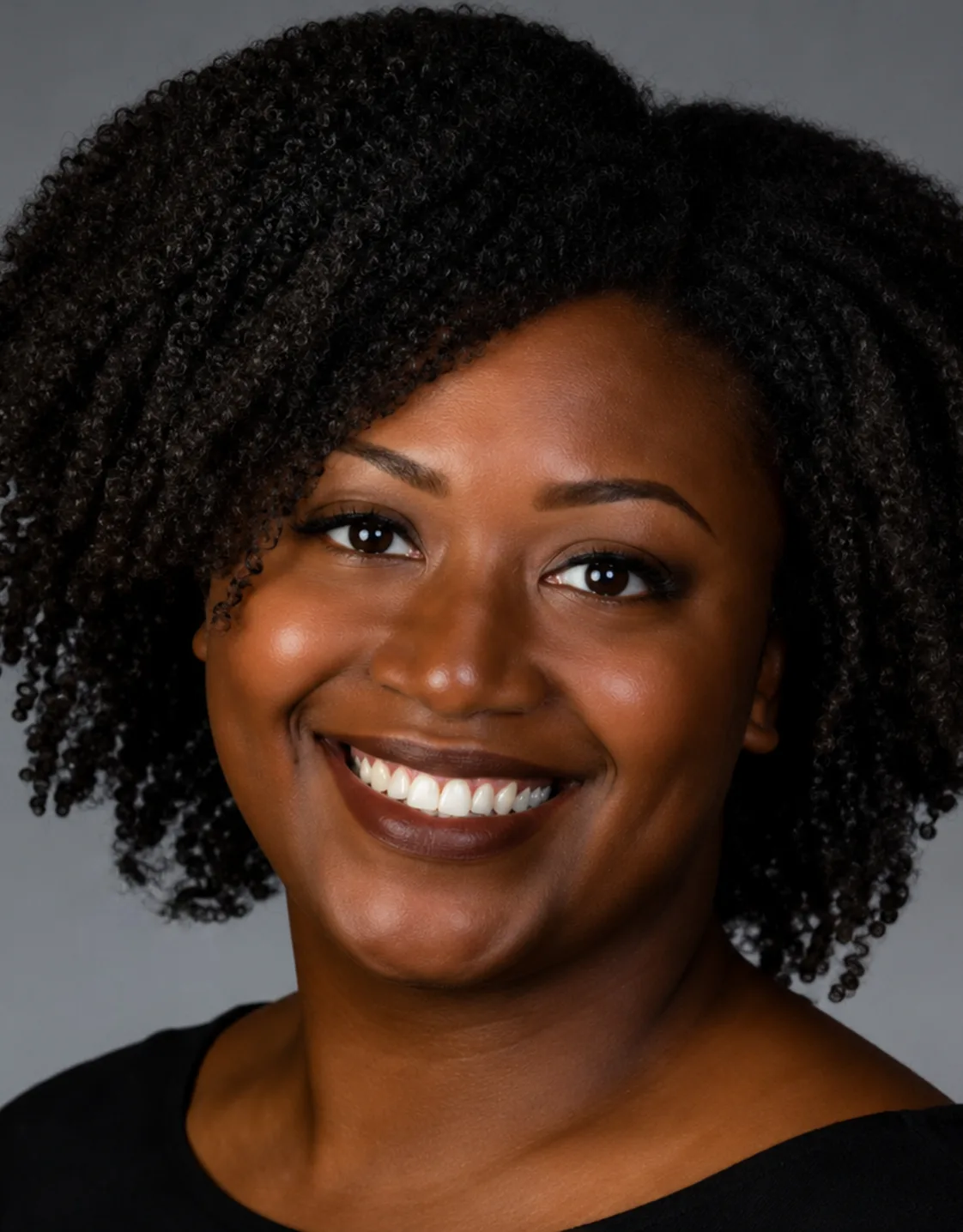 Dr. Leah Douglas in a black shirt smiling Dr. Leah Douglas in a black shirt smiling