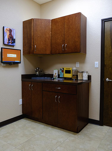 Examination room at Metzler Veterinary Hospital with wooden cabinets