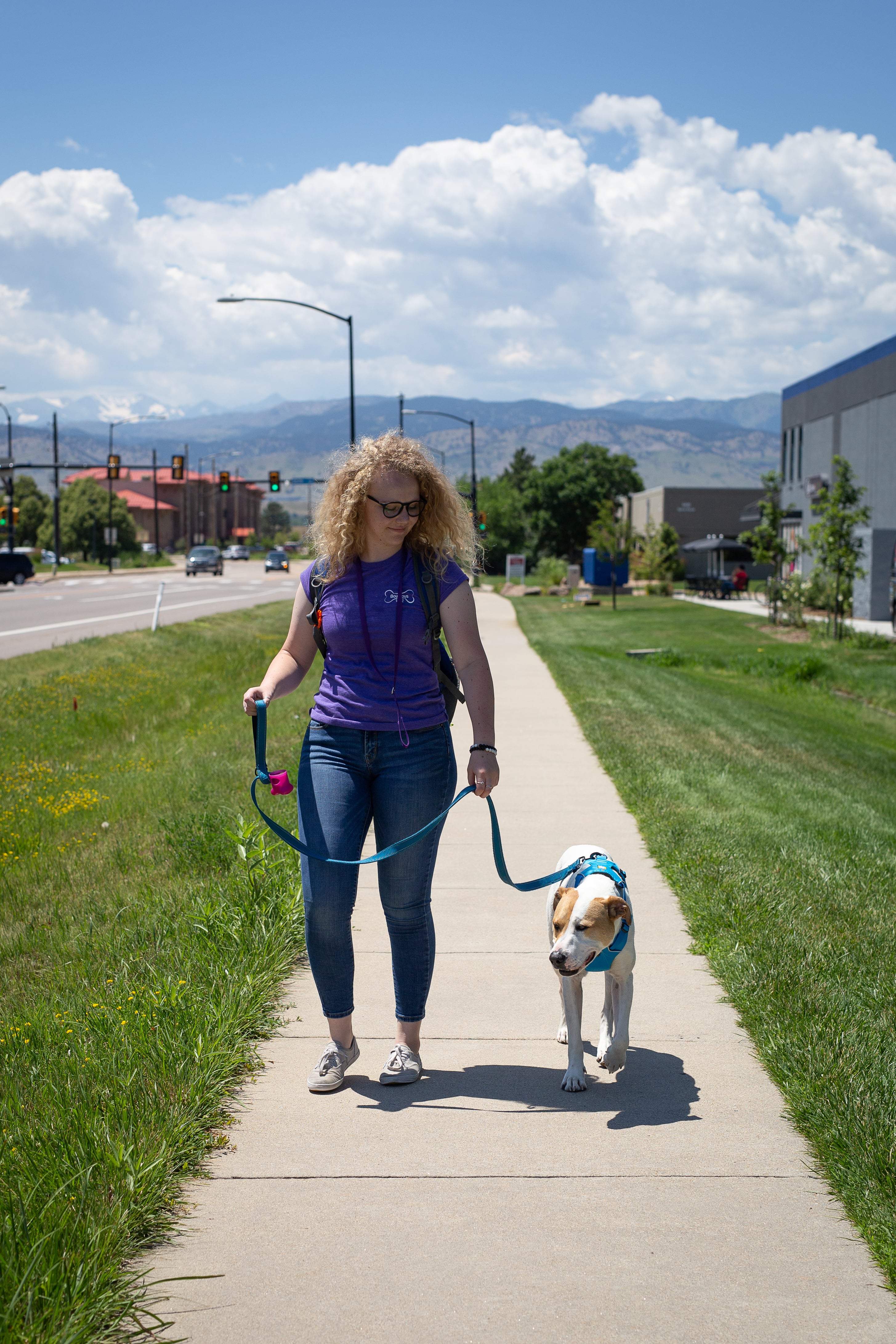 Staff walking with dog at Bowhaus in Boulder, CO