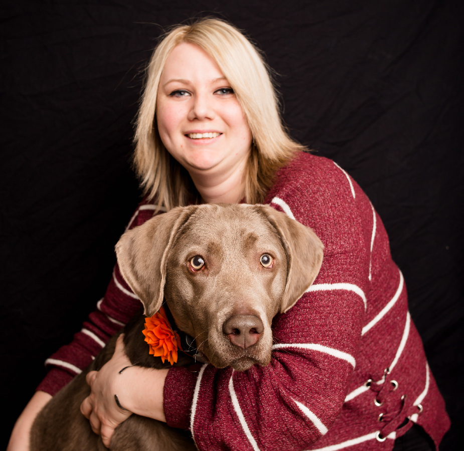 A Kindness Animal Hospital staff member with a dog