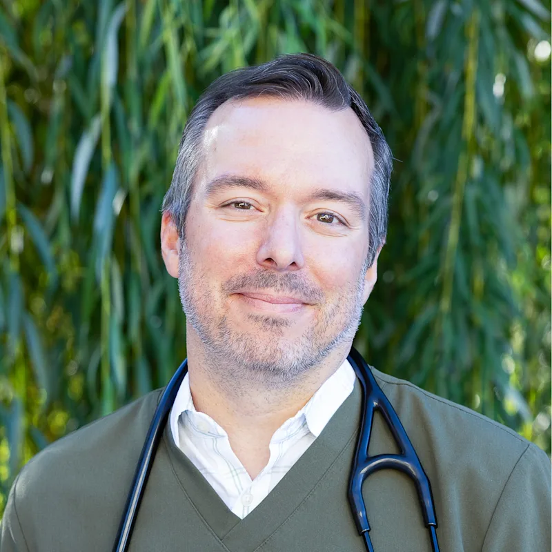 Dr. Peter Woodward holding a cat. Dr. Peter Woodward holding a cat.