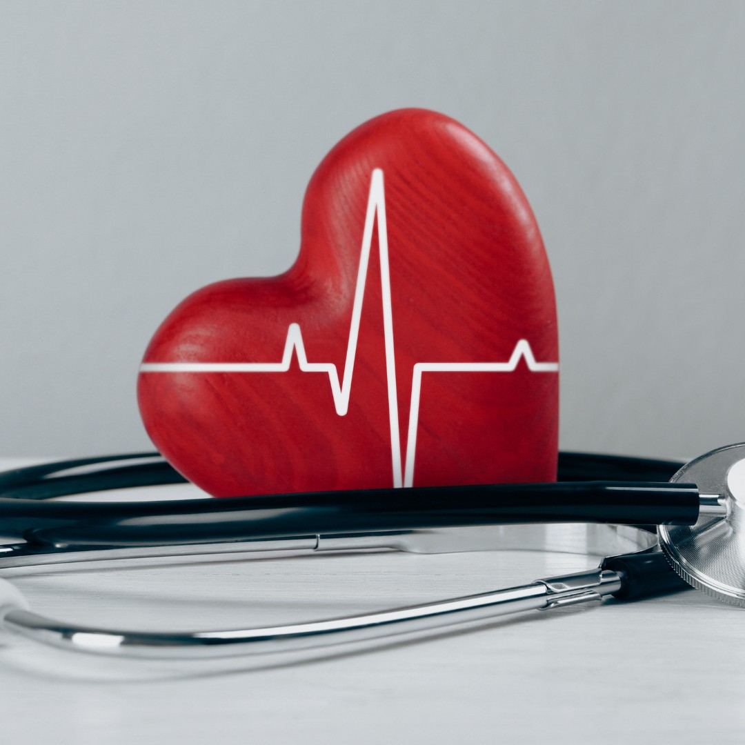 red heart with lifeline printer on it and a stethoscope next to it.