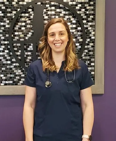 Dr. Monika Janssen in front of a purple wall