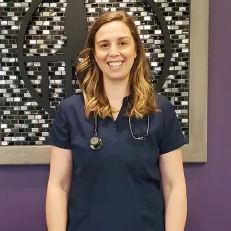 Dr. Monika Janssen in front of a purple wall Dr. Monika Janssen in front of a purple wall