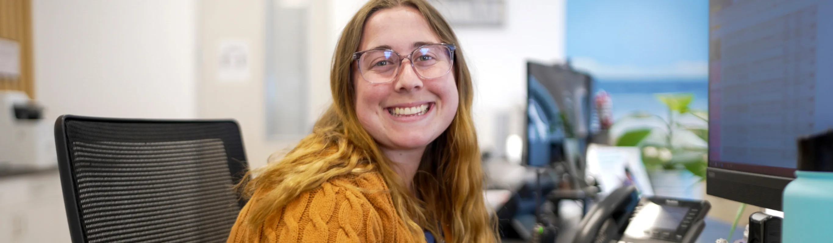 Staff member smiling Staff member smiling