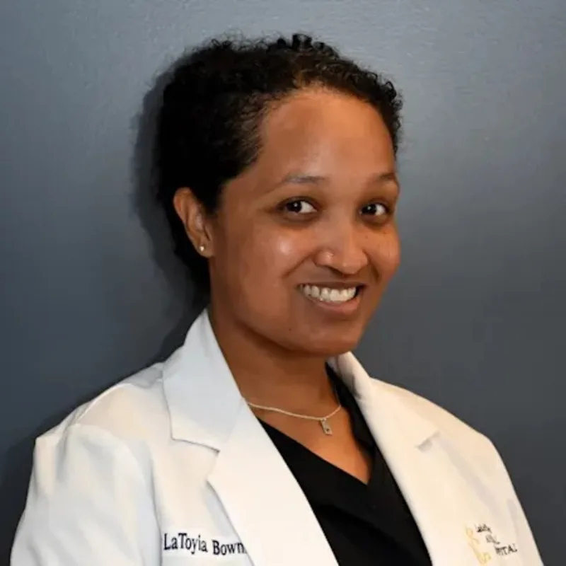 Dr. LaToyia Bowman holding cat at Lake Street Animal Hospital Dr. LaToyia Bowman holding cat at Lake Street Animal Hospital
