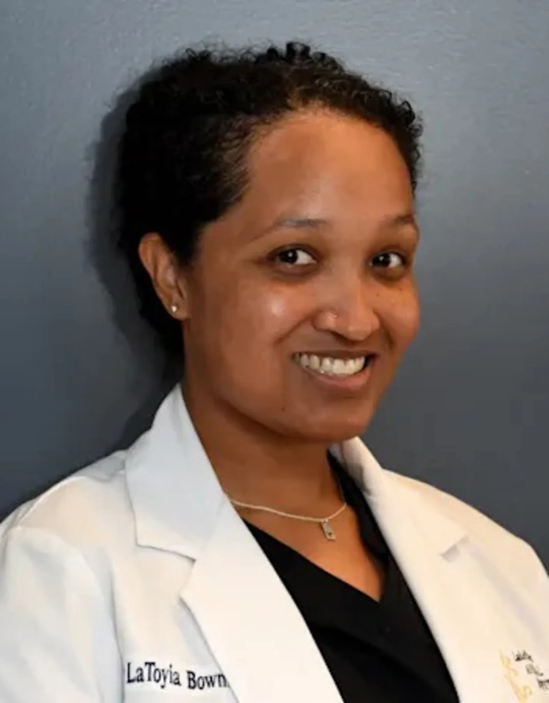 Dr. LaToyia Bowman holding cat at Lake Street Animal Hospital Dr. LaToyia Bowman holding cat at Lake Street Animal Hospital