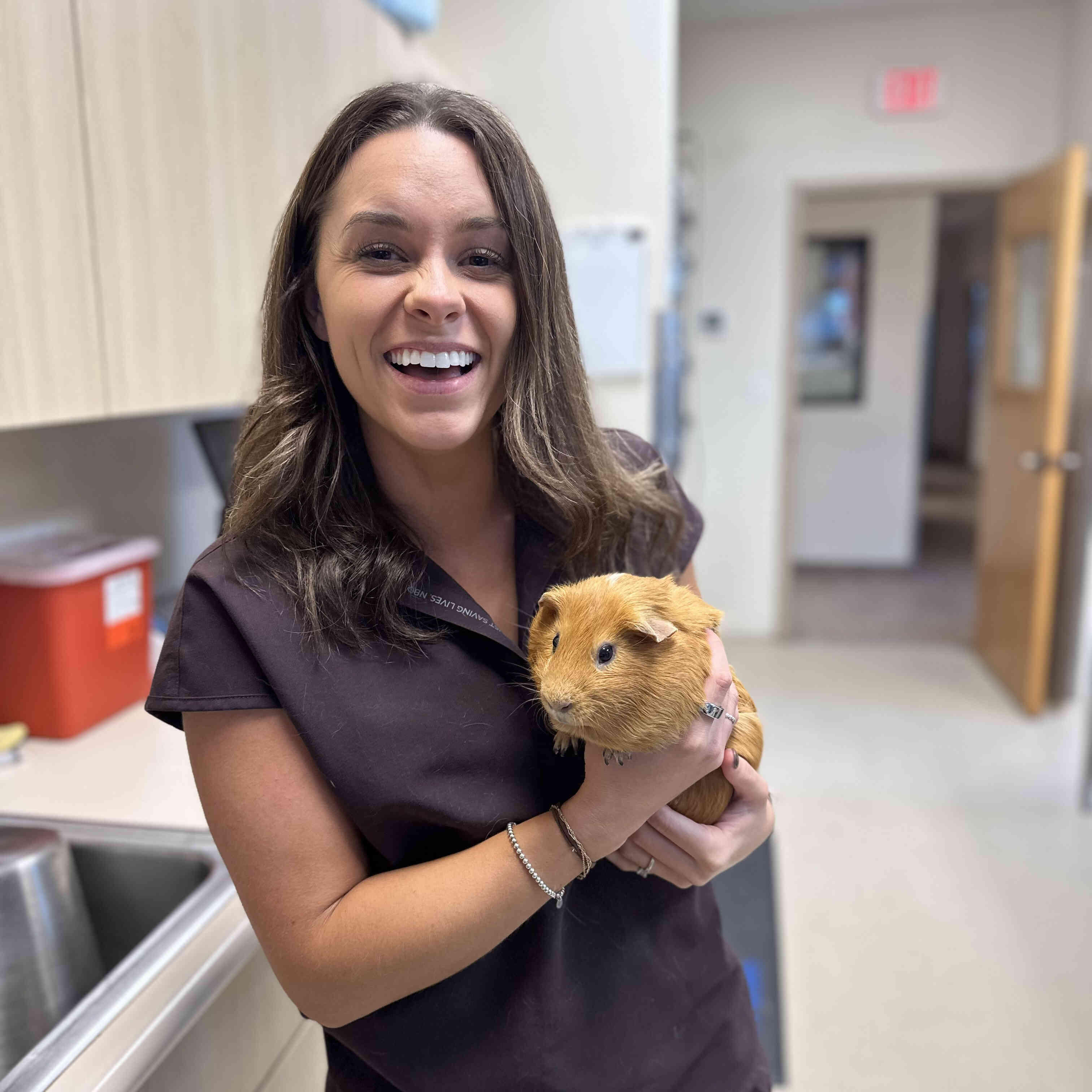 Dr. DeBruhl Holding a Guinea Pig