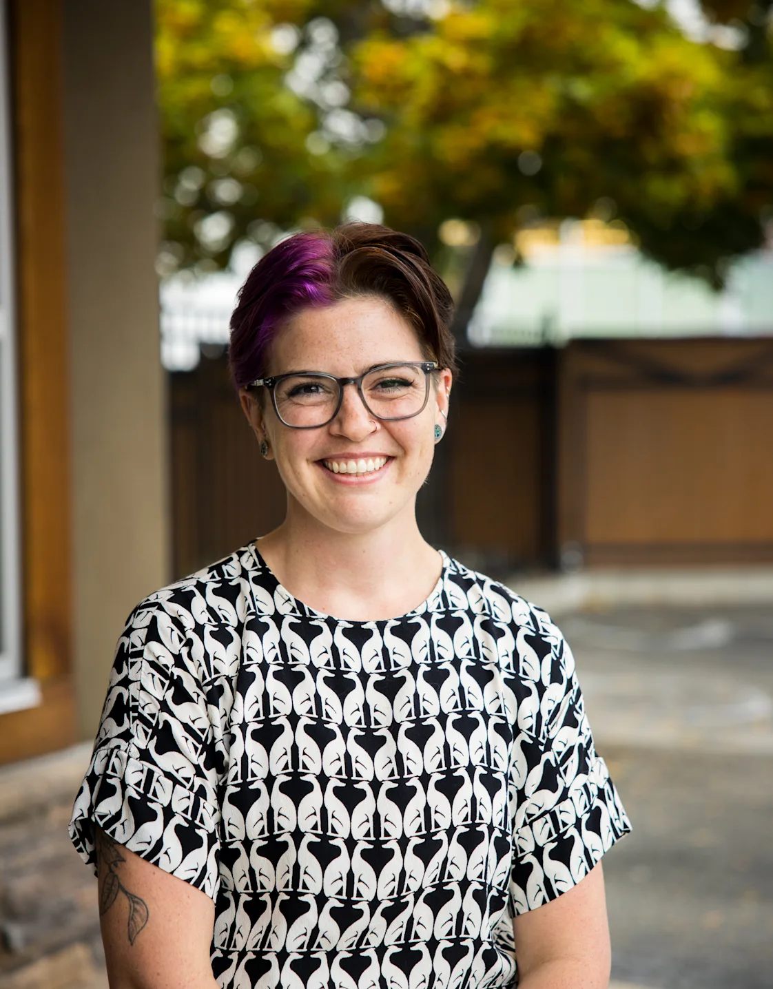 Dr. Fitzgerald smiling sitting outside Dr. Fitzgerald smiling sitting outside