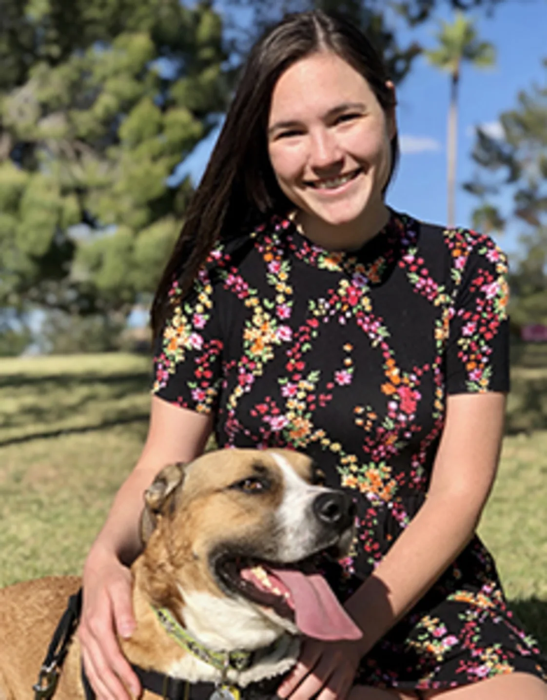 Madison Horton sitting with a tan and white dog Madison Horton sitting with a tan and white dog