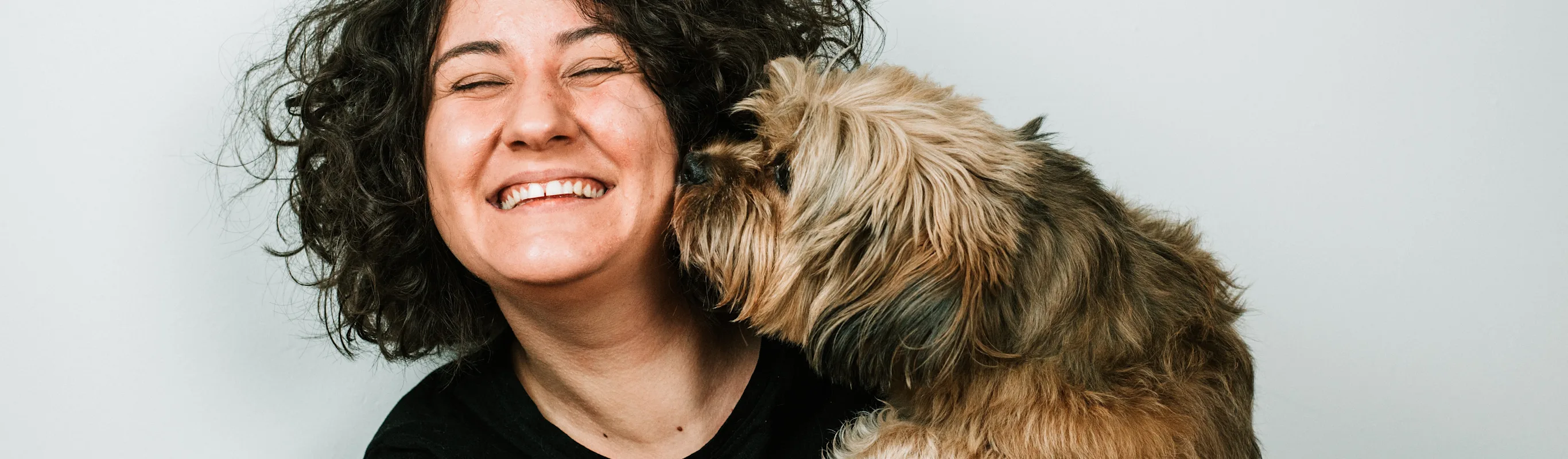 Girl laughing with dog