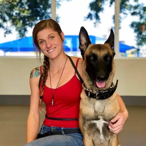 Lauderdale Pet Lodge trainer, Hannah, and a dog