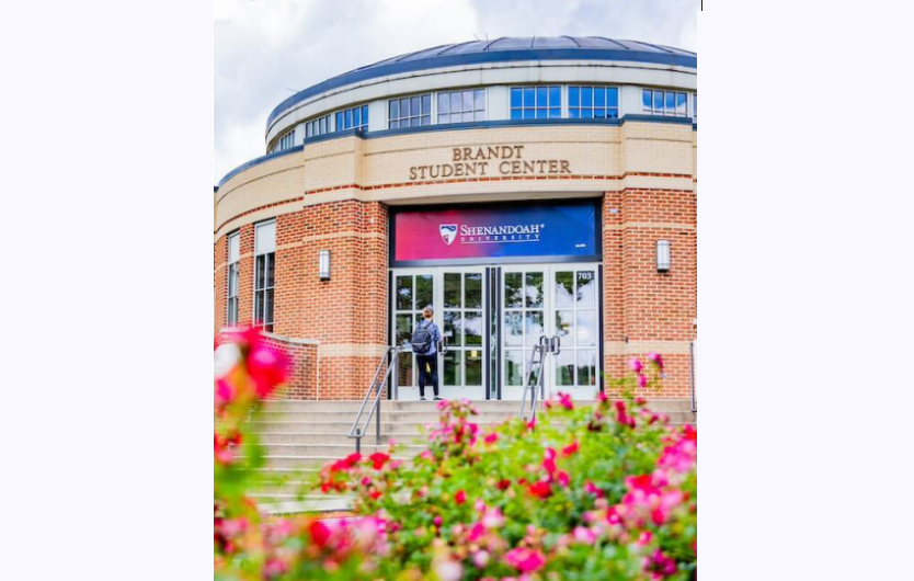 Brandt student center building and a bush of flowers
