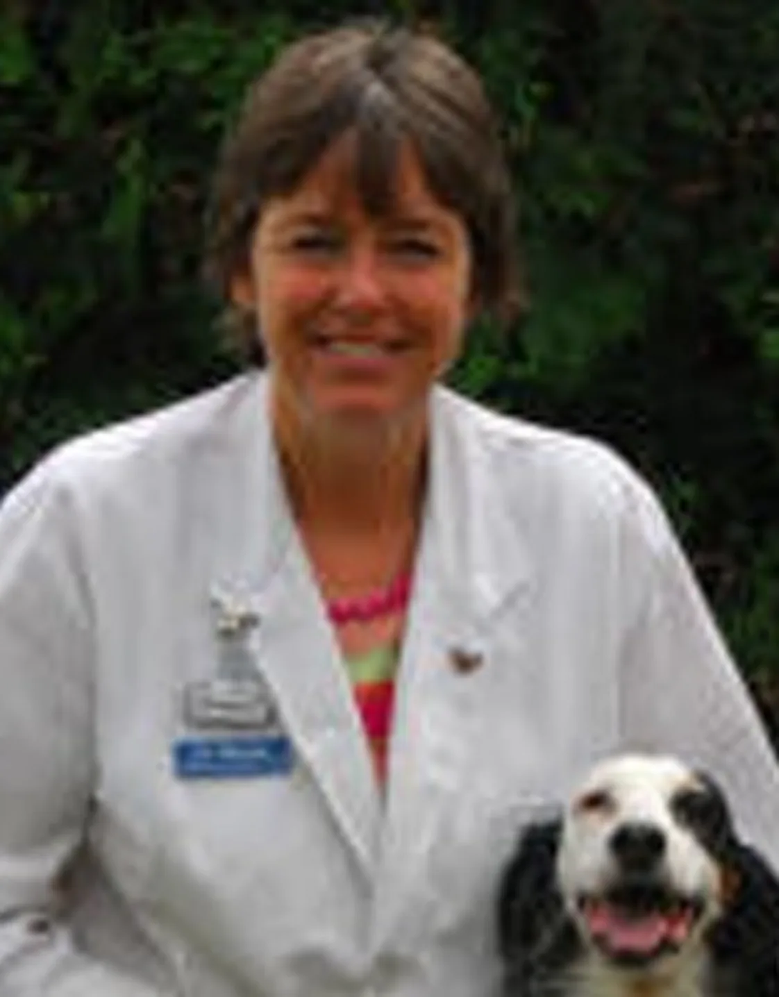 Dr. Elizabeth Thorson's staff photo from Stillwater Veterinary Clinic where she's posing with her black and white cockerspaniel outside. Dr. Elizabeth Thorson's staff photo from Stillwater Veterinary Clinic where she's posing with her black and white cockerspaniel outside.