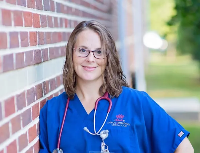 Staff member Julie by brick wall Staff member Julie by brick wall