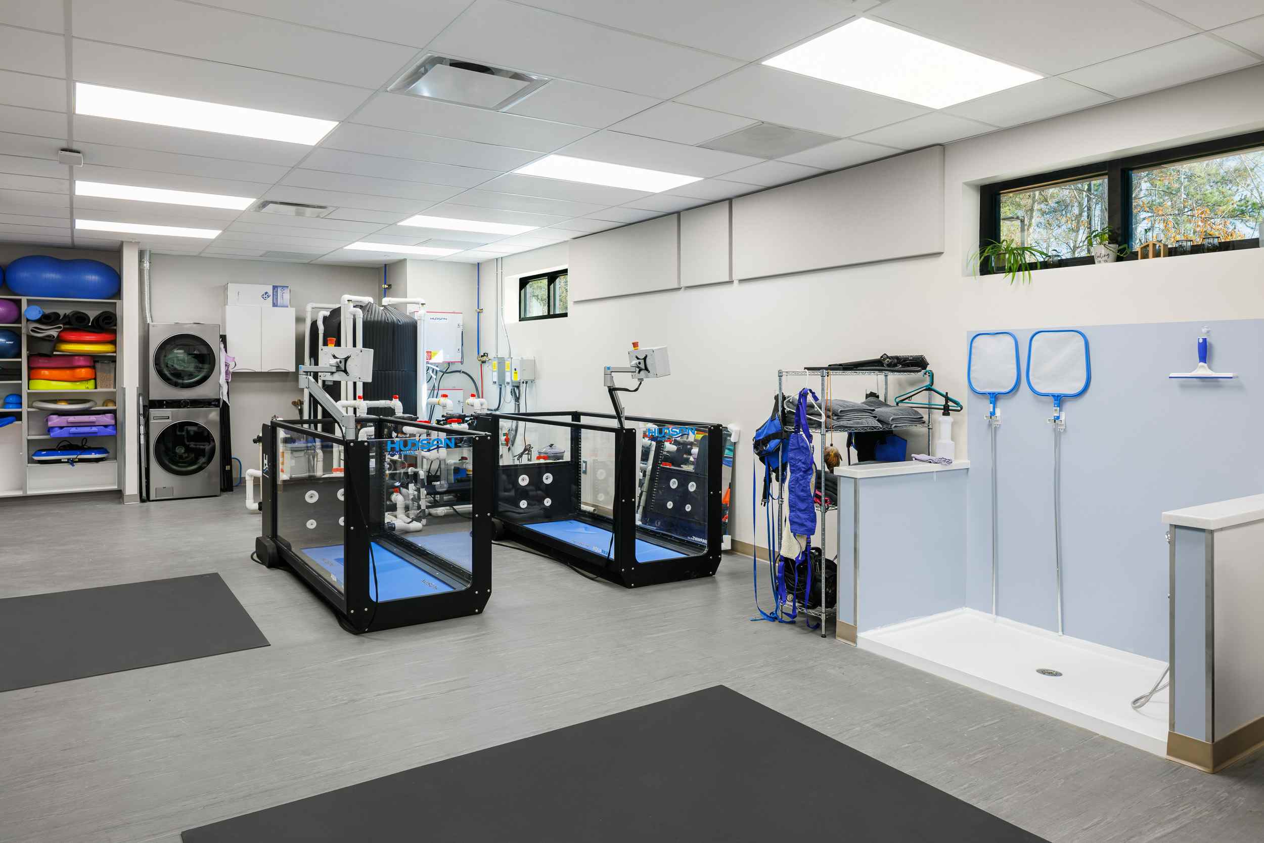 Two underwater treadmills sitting next to each other.