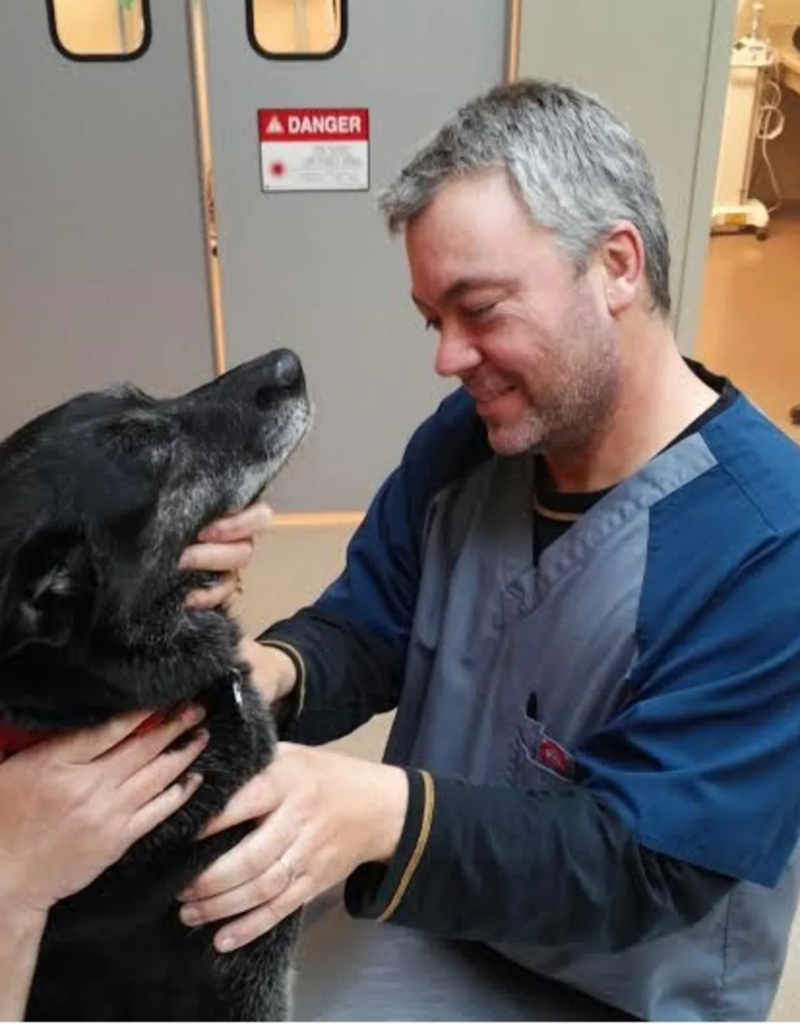 Jim Heine holding two dogs Jim Heine holding two dogs