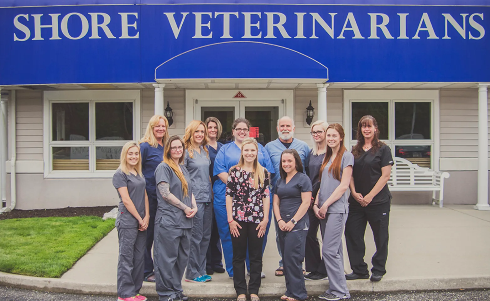 Shore Veterinarians staff in front of building. Shore Veterinarians staff in front of building.