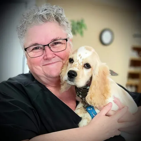 Williamstown Veterinary Services staff member Elizabeth holding a dog
