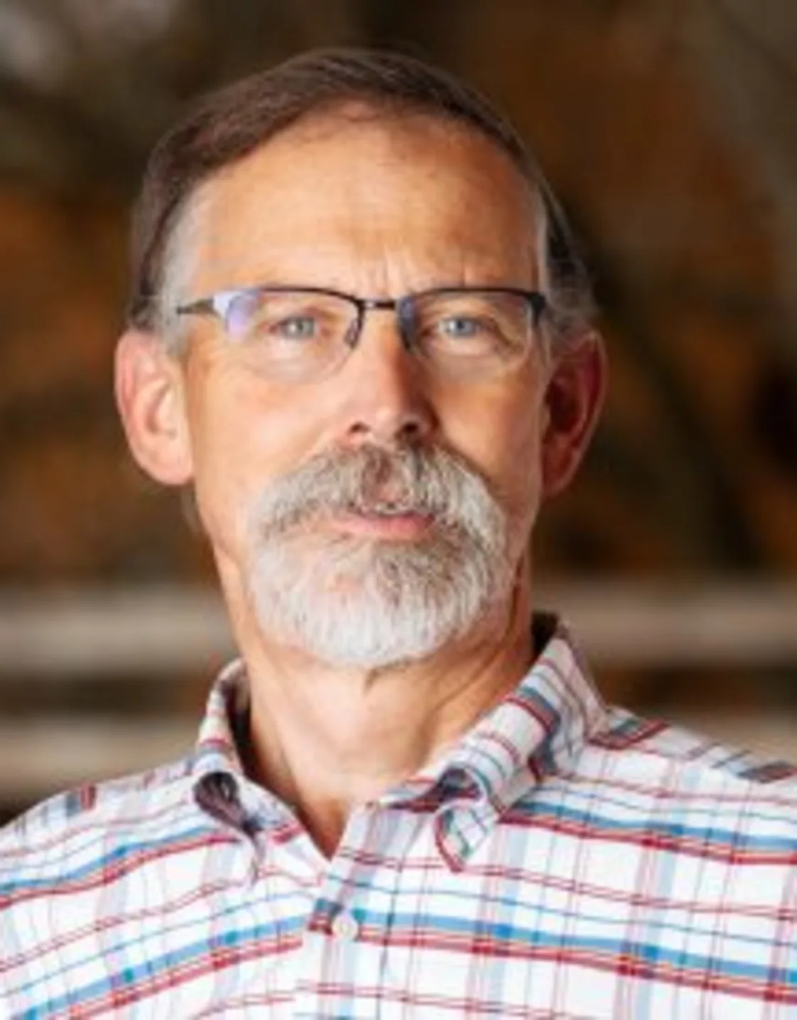 Dr. Andrew Cross in front of nature Dr. Andrew Cross in front of nature