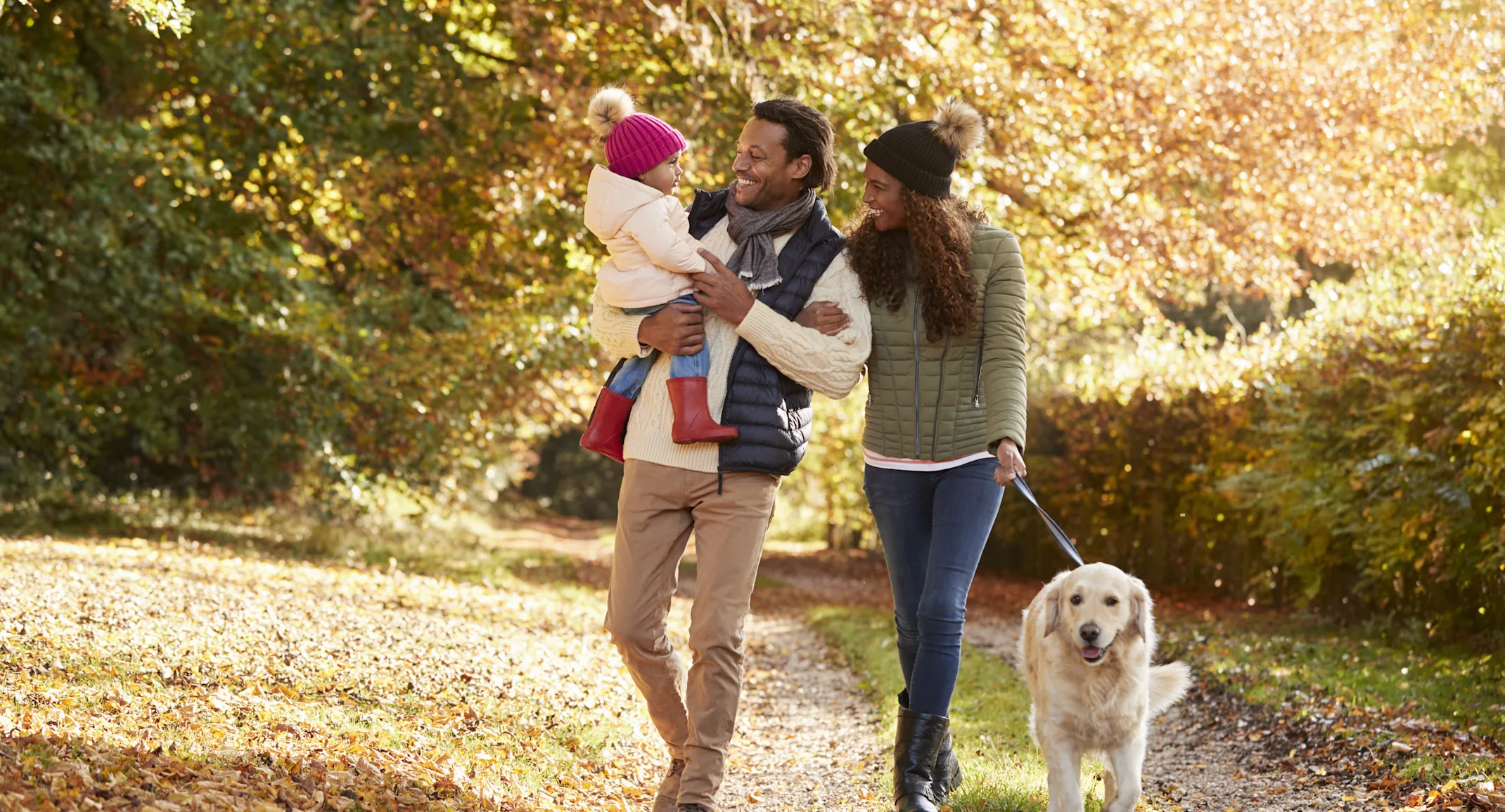 Family walking their dog