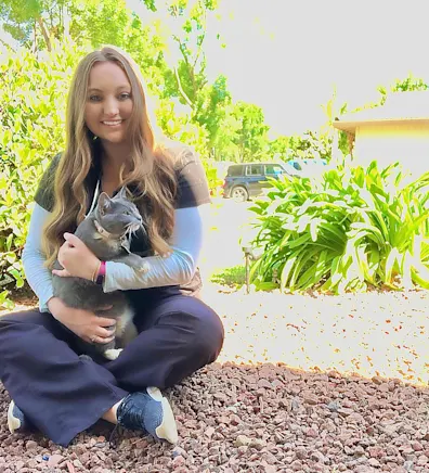 Briana's staff photo from Merced Animal Medical Center where she is sitting down with her cat on her lap. Briana's staff photo from Merced Animal Medical Center where she is sitting down with her cat on her lap.