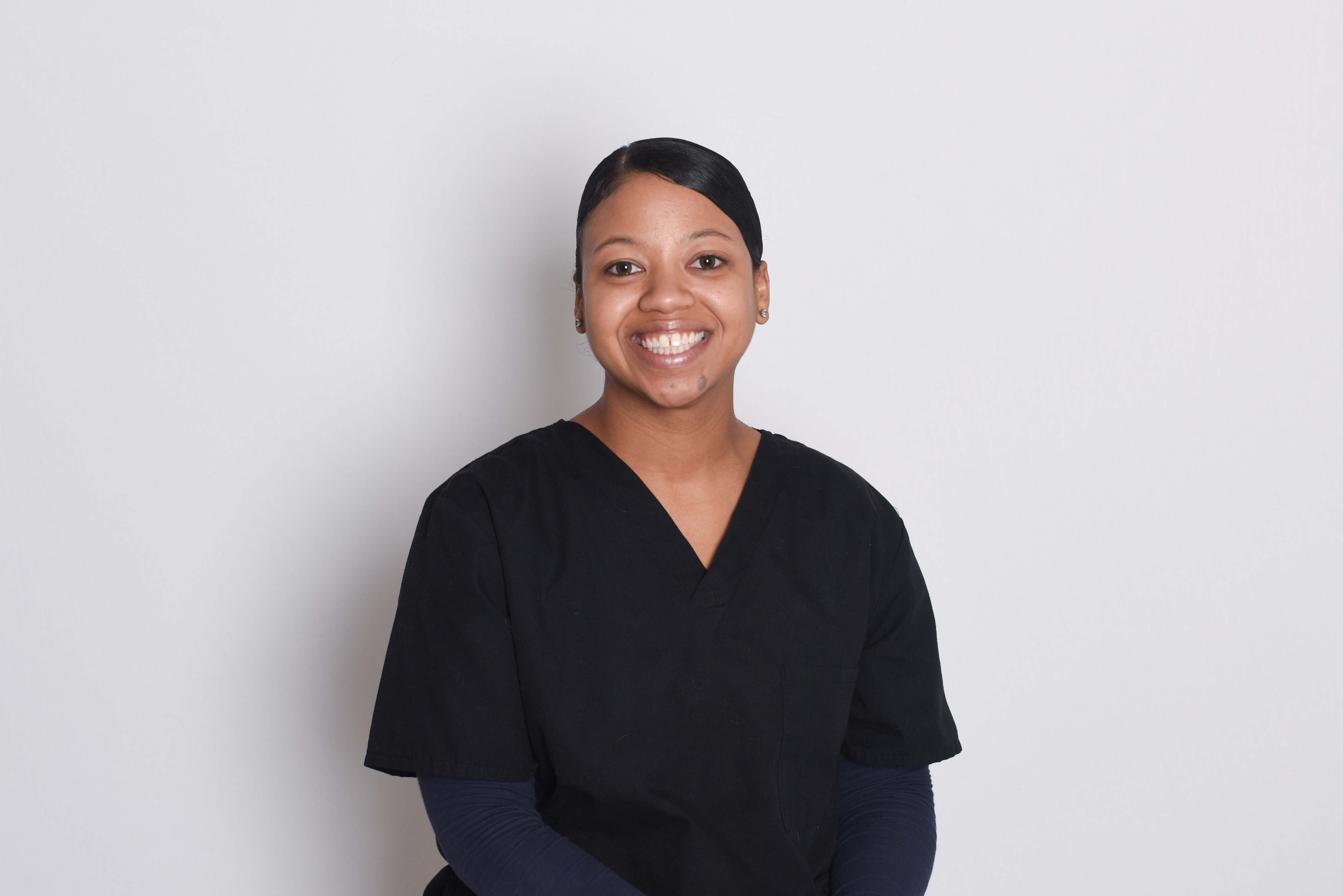 Tashia against a light grey background.