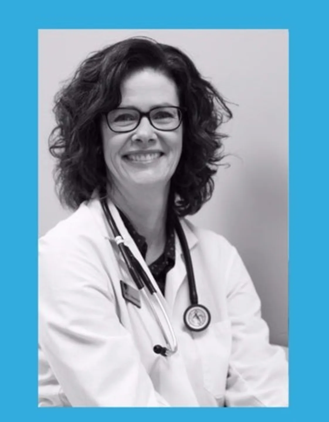 Dr. Suzanne Adams-Hird smiling in front of the camera. Dr. Suzanne Adams-Hird smiling in front of the camera.