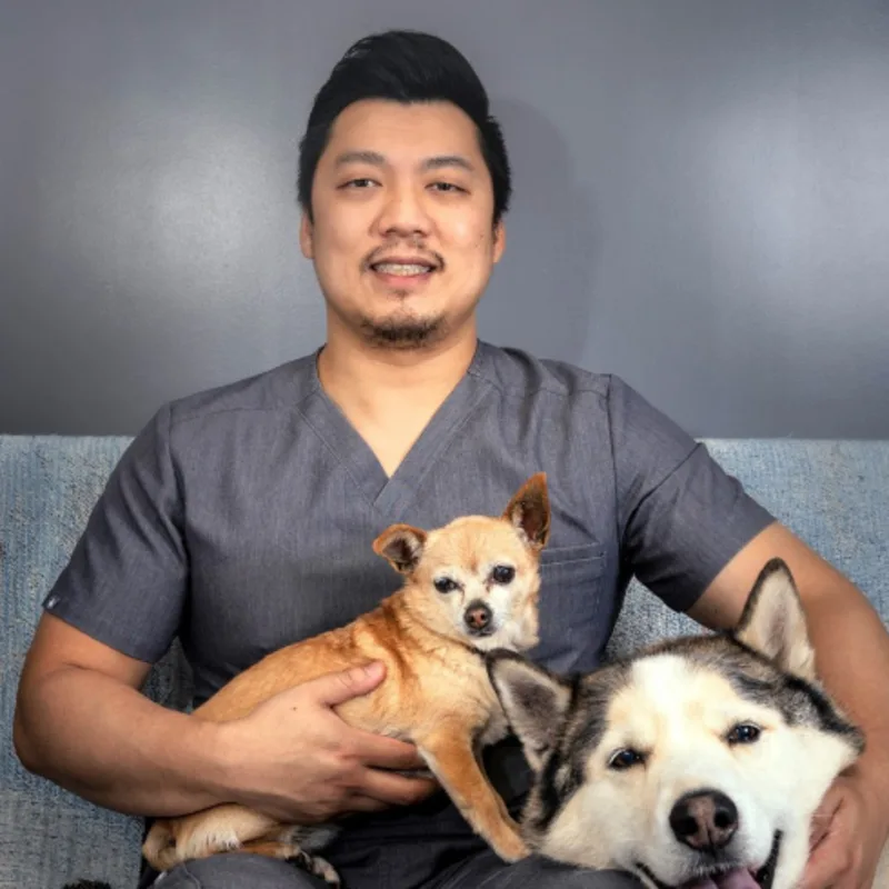 Dr. Nguyen with Two Dogs Dr. Nguyen with Two Dogs