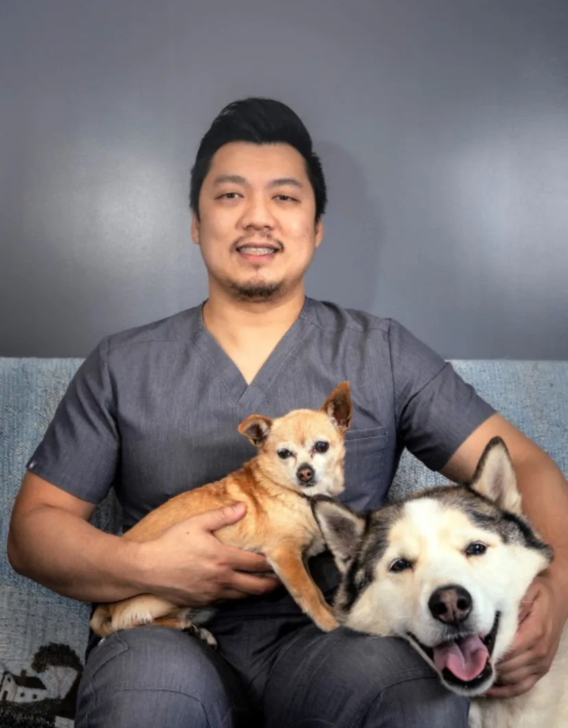 Dr. Nguyen with Two Dogs