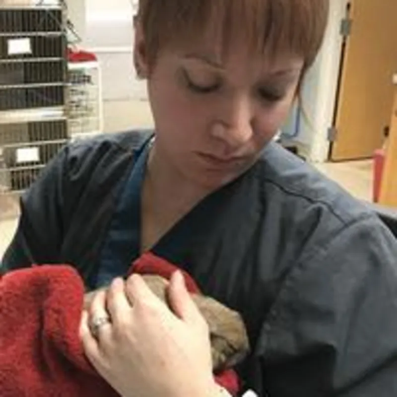 Angela holding a pet Angela holding a pet