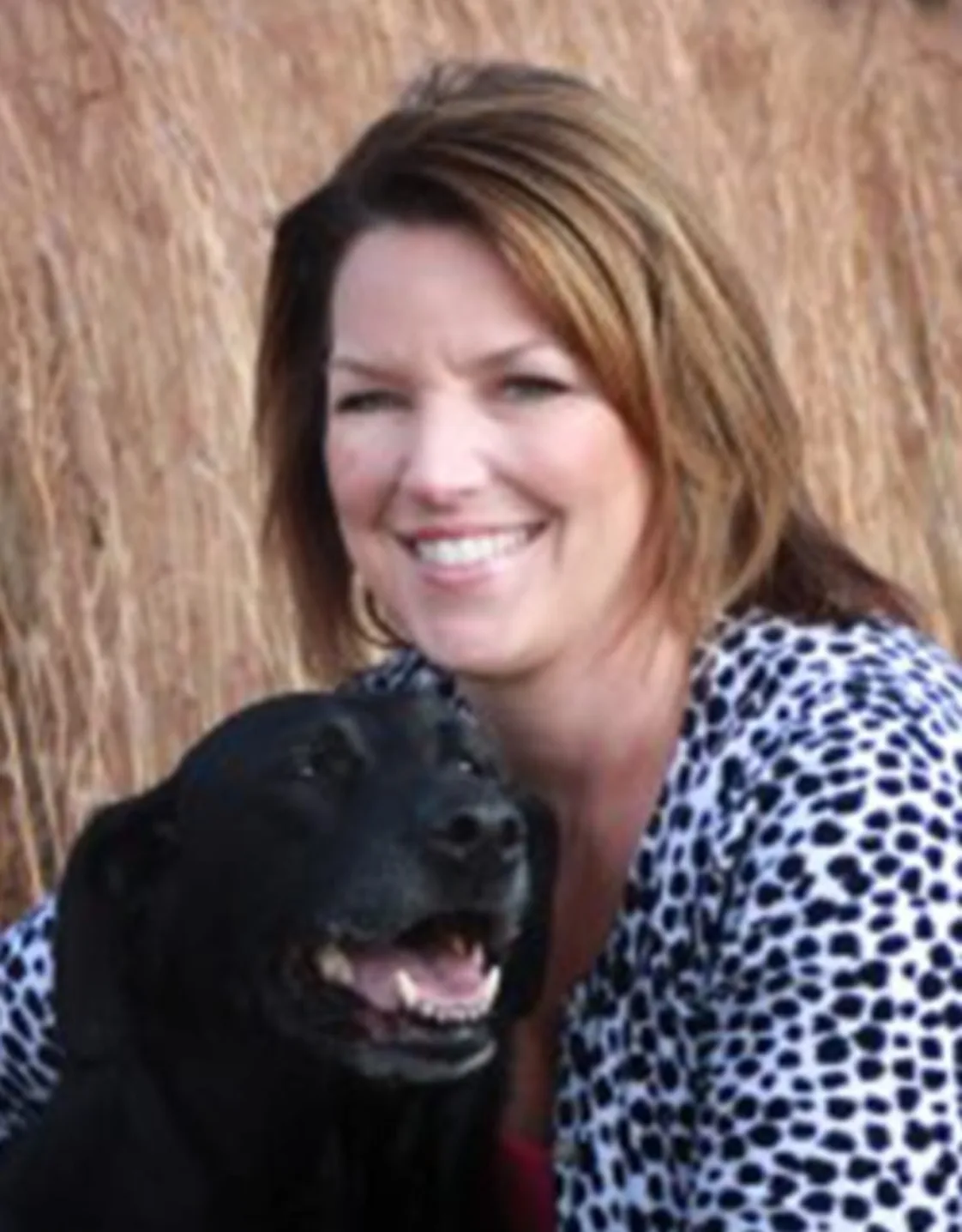 Dr. Leslie Burchett with A dog Dr. Leslie Burchett with A dog