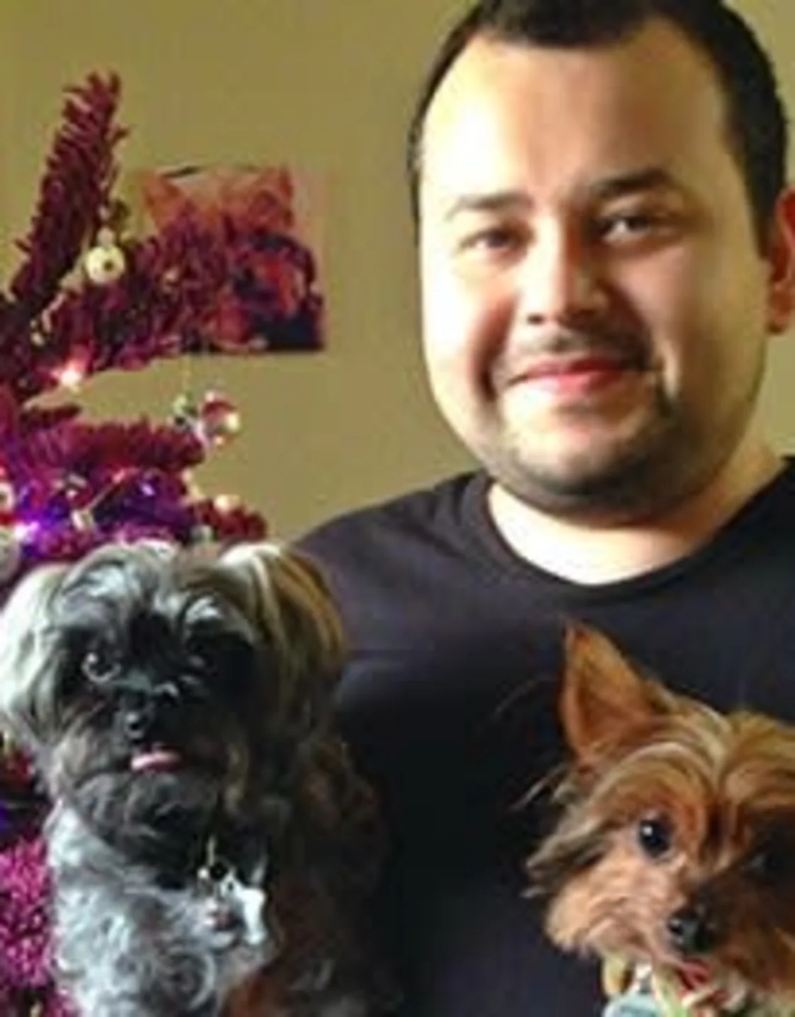 Brandon holding two small dogs Brandon holding two small dogs