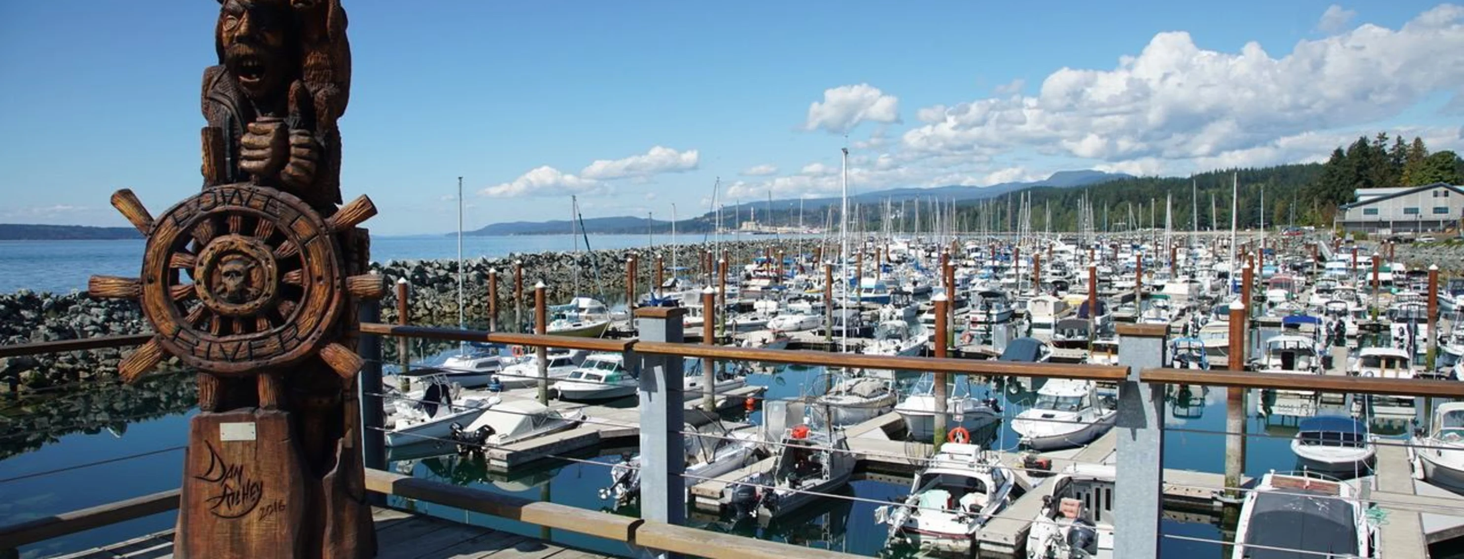Wooden totem pool sitting on a dock on a boatyard. Wooden totem pool sitting on a dock on a boatyard.