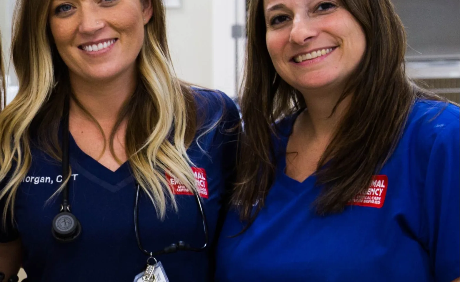 2 female staff members stand together at the Animal Specialty & Emergency Center of Brevard